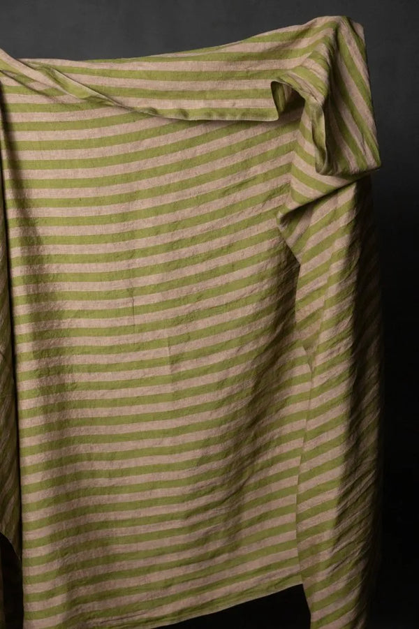 A muted green and pale pink striped linen fabric